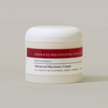Jar of Advanced Recovery Cream with a red label on a beige background