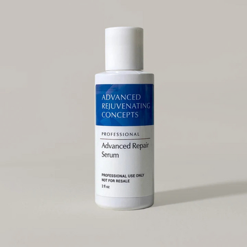 Bottle of Advanced Repair Serum by Advanced Rejuvenating Concepts on a light gray background