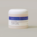 Jar of pumpkin cream with a label on a light gray background
